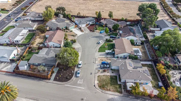 an aerial view of multiple houses with outdoor space
