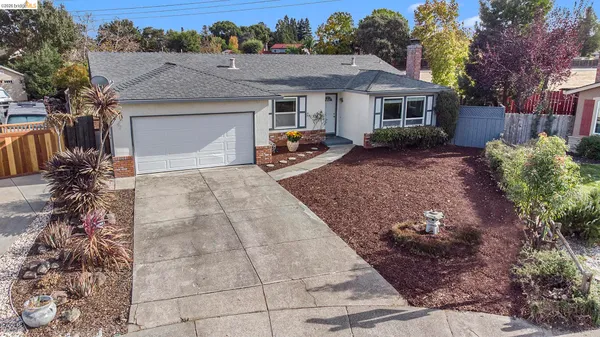 a view of a yard in front view of a house