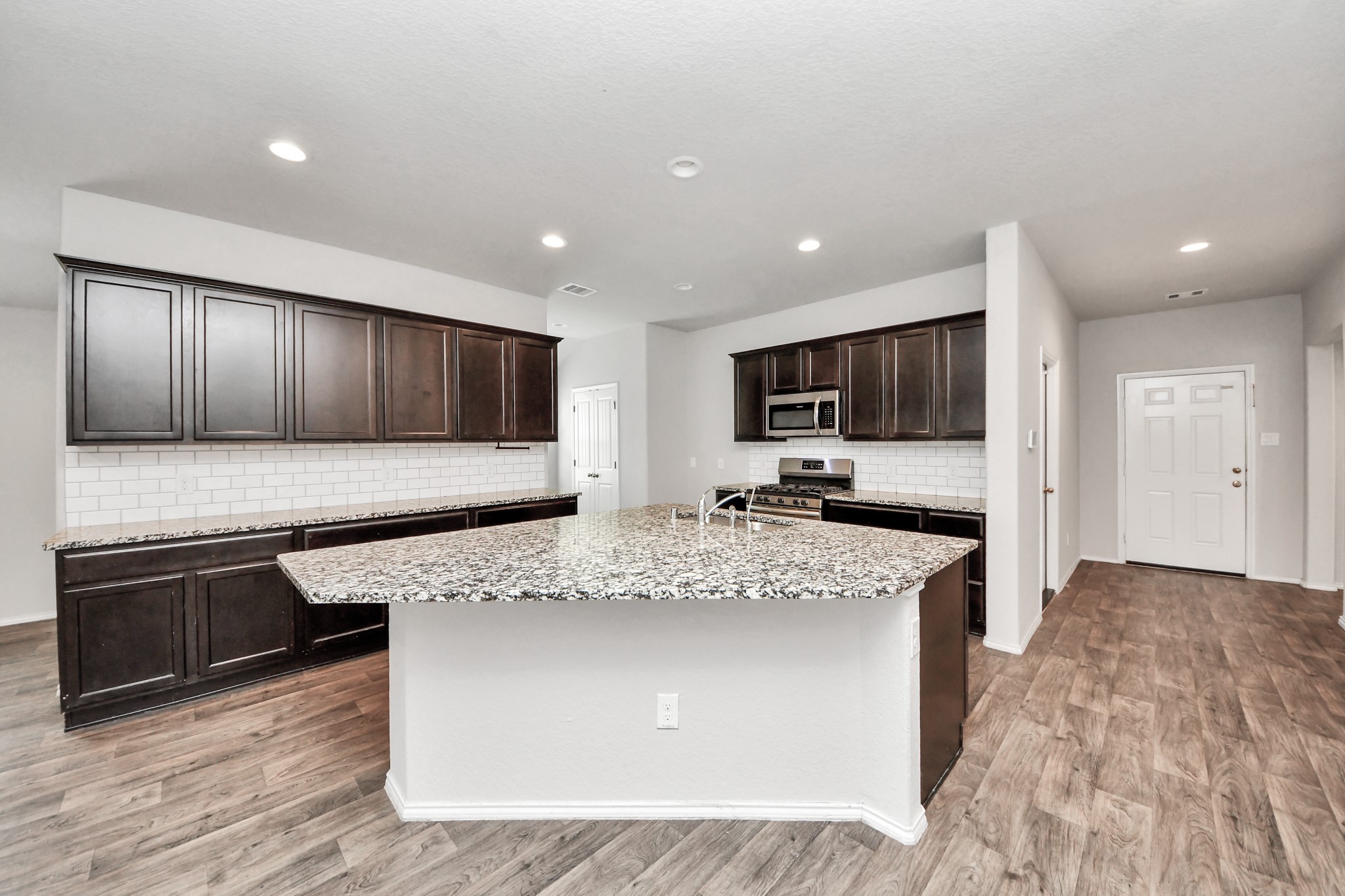 8302 Rose Petals Lane Rosharon, TX 77583 - Photo 4 of 42 Spacious kitchen island and open layout