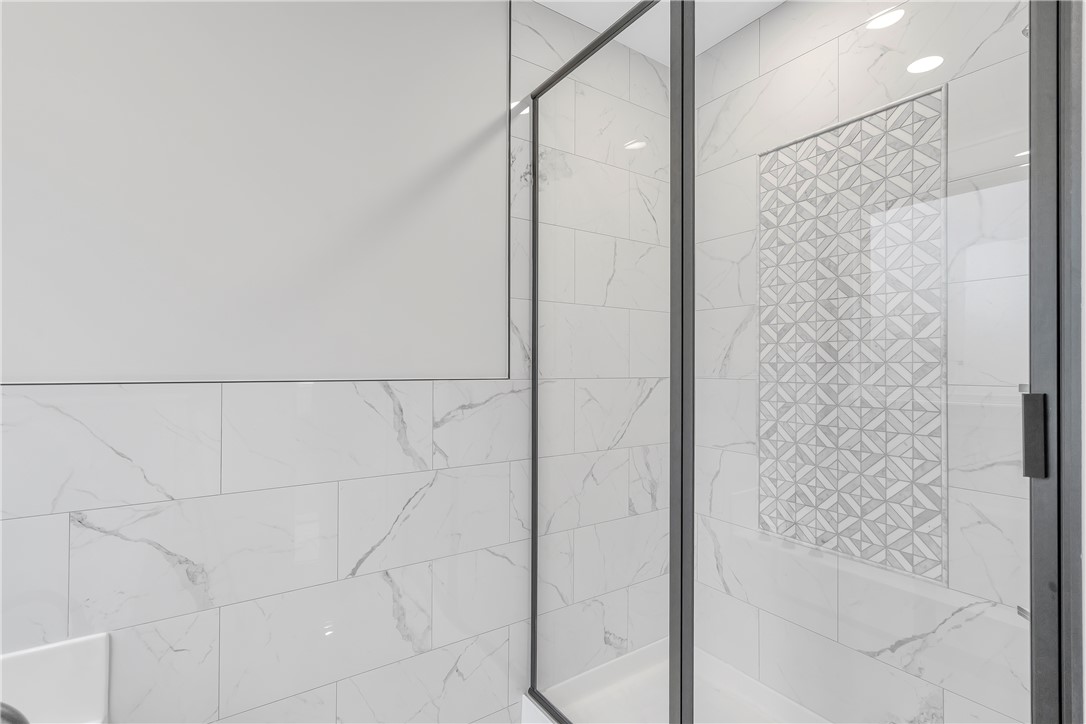 4554 Flat Rock Road Iva, SC 29655 - Photo 24 of 32 A well-lit, contemporary shower with elegant tile work and a sleek glass enclosure.