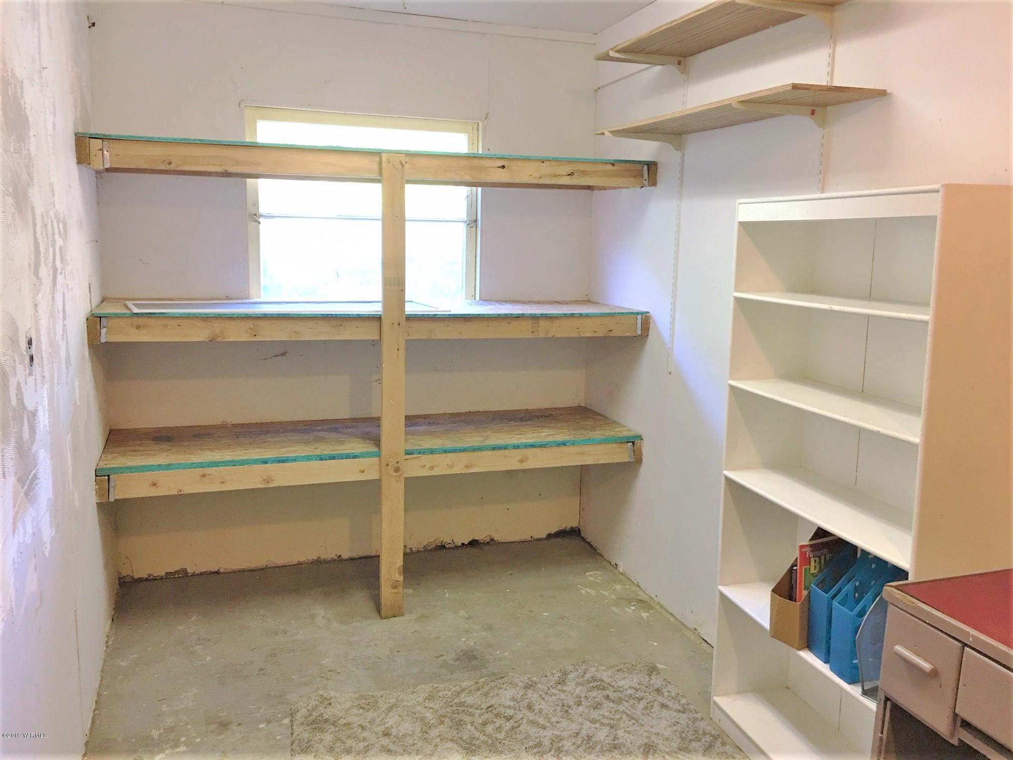 1220 Swan Road Sunnyside, WA 98944 - Photo 16 of 22 a view of walk in closet with empty racks