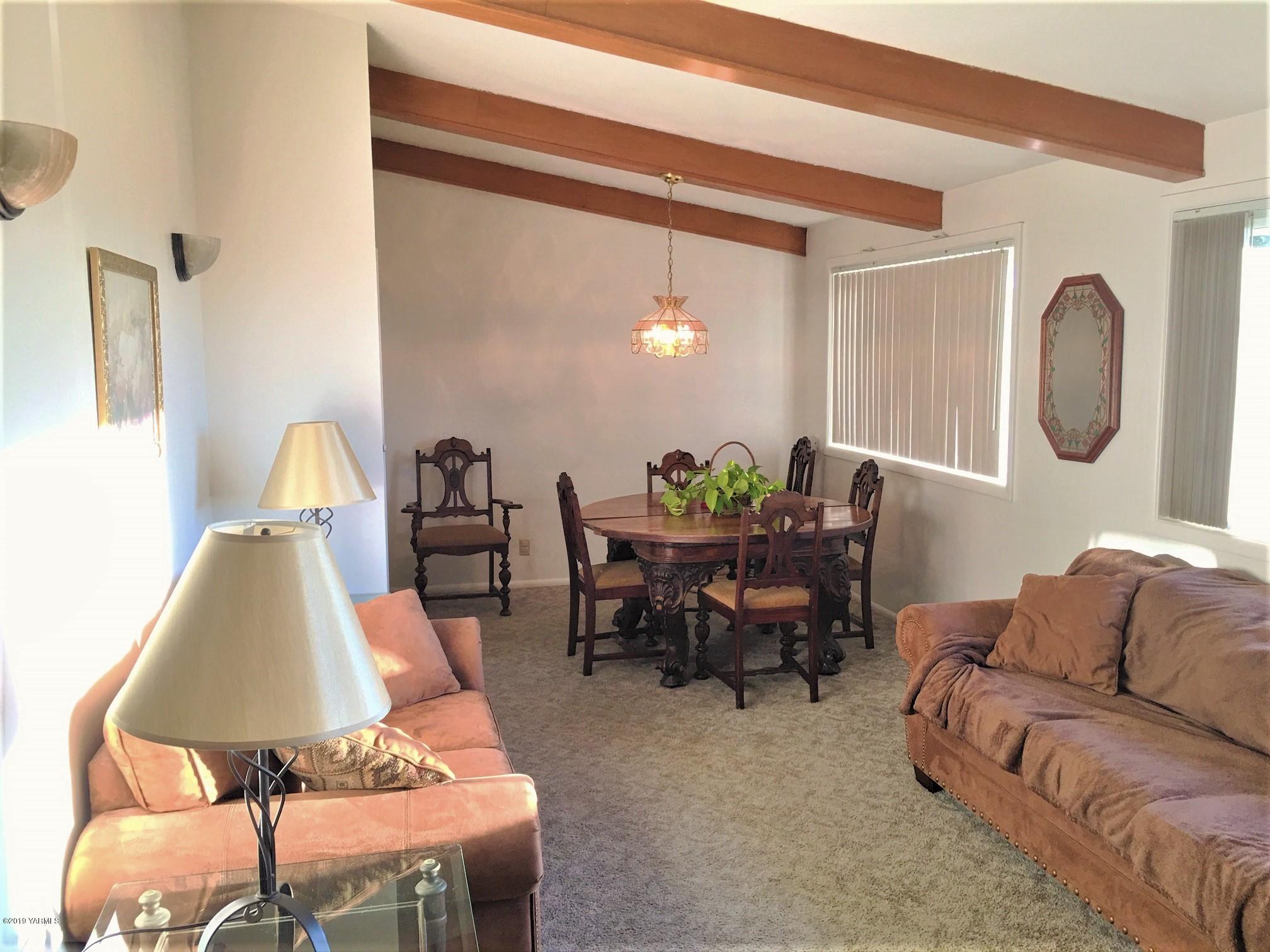 1220 Swan Road Sunnyside, WA 98944 - Photo 7 of 22 a living room with furniture and wooden floor