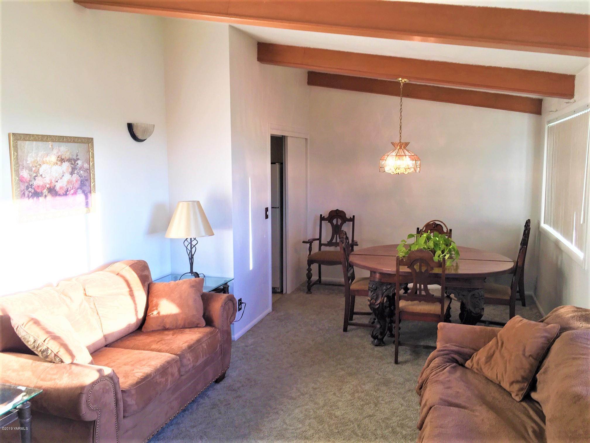 1220 Swan Road Sunnyside, WA 98944 - Photo 8 of 22 a living room with furniture and a potted plant
