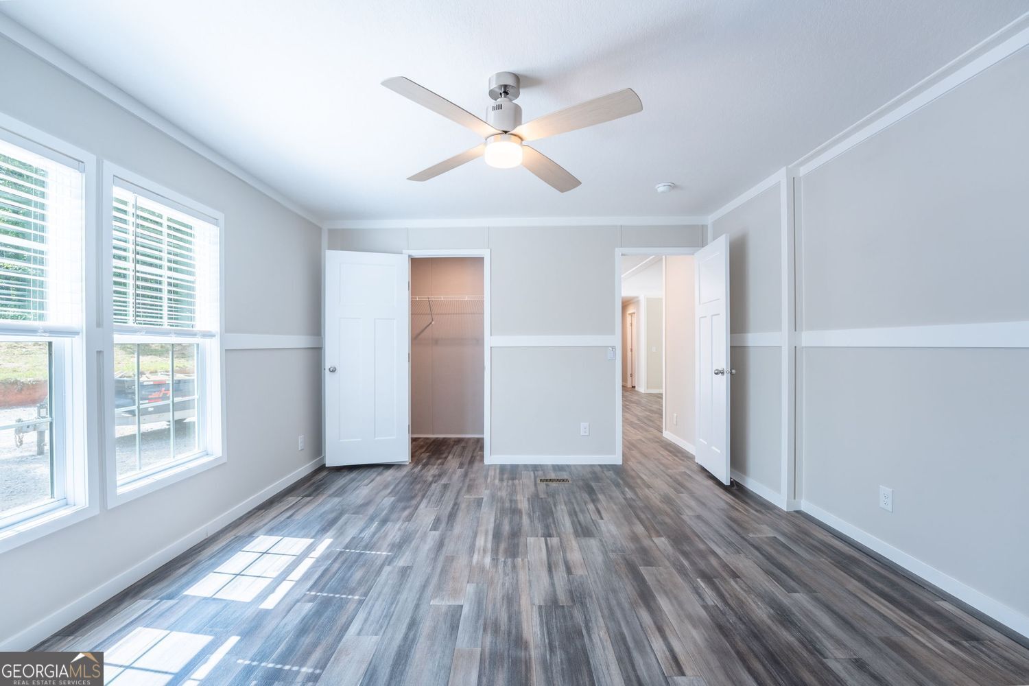 734 Hollywood Church Road Clarkesville, GA 30523 - Photo 30 of 49 a view of an empty room with wooden floor and a window