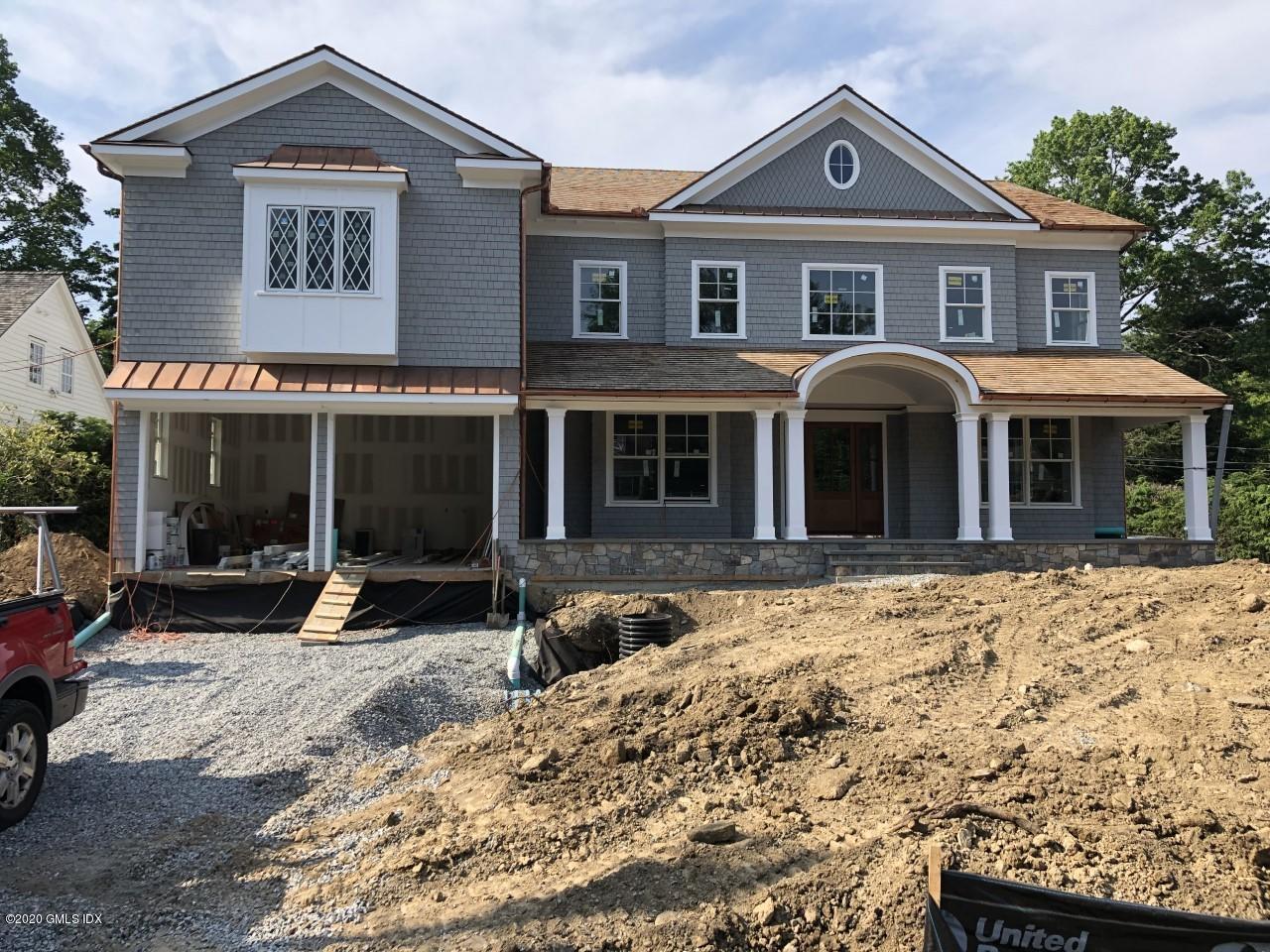 14 Winthrop Drive Riverside, CT 06878 - Photo 1 of 6 a front view of a house with a yard