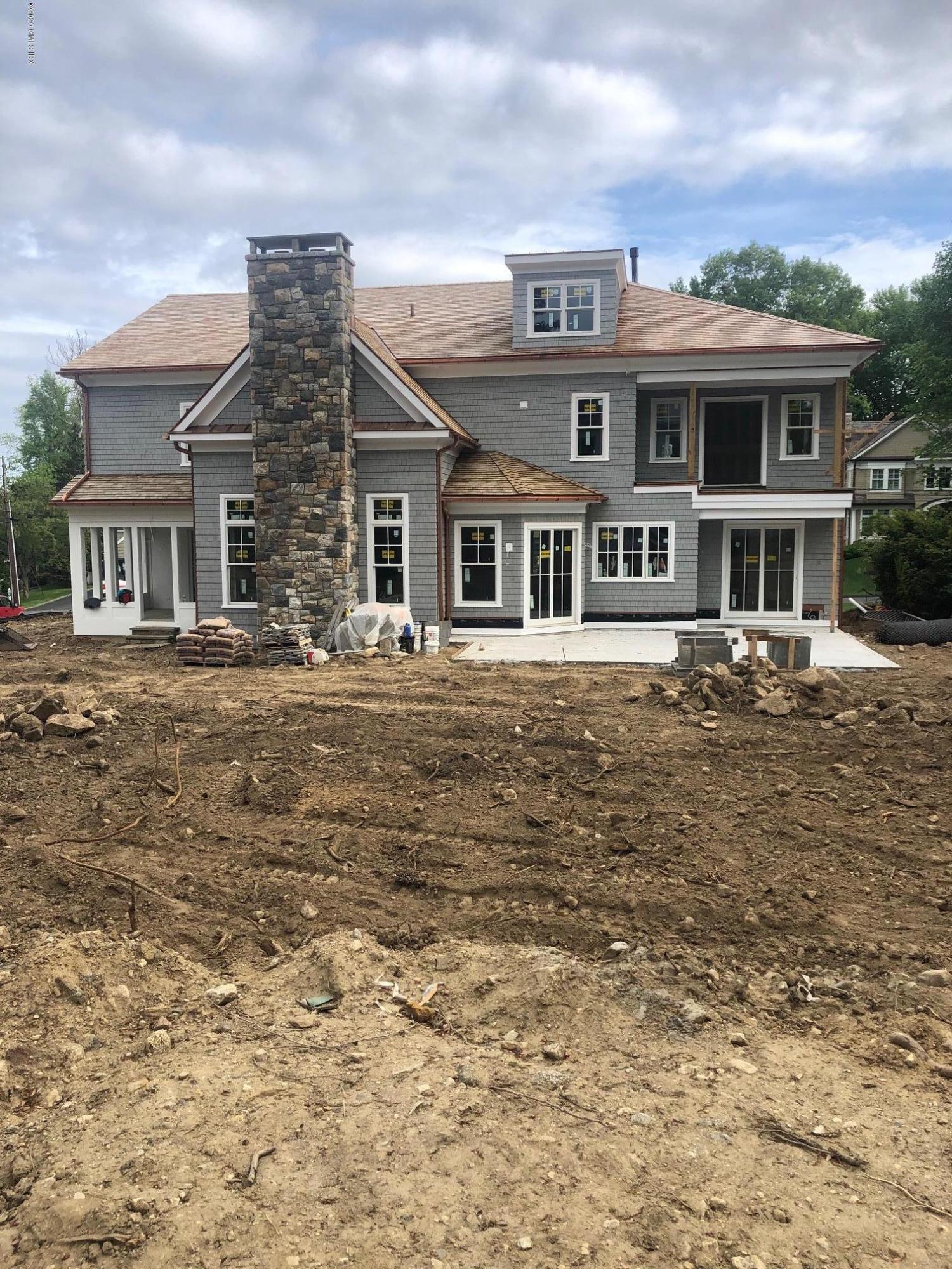 14 Winthrop Drive Riverside, CT 06878 - Photo 2 of 6 a front view of a house with a yard