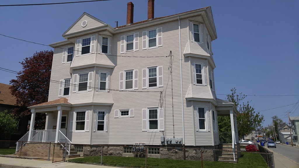 315 Mott Street Fall River, MA 02721 - Photo 2 of 20 a front view of a house with a yard