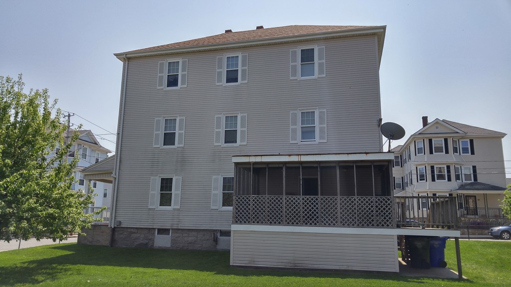 315 Mott Street Fall River, MA 02721 - Photo 3 of 20 a front view of a house with a yard
