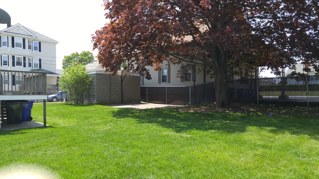315 Mott Street Fall River, MA 02721 - Photo 7 of 20 a view of backyard with house and garden