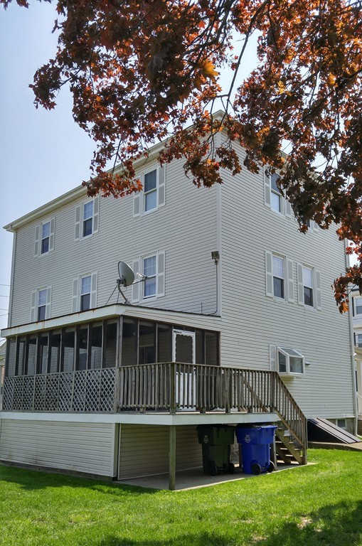 315 Mott Street Fall River, MA 02721 - Photo 9 of 20 a view of a house with backyard porch and sitting area
