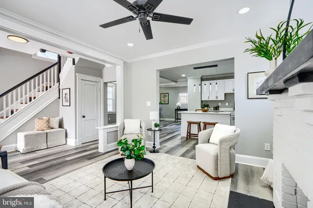 a view of a livingroom with furniture window and wooden floor