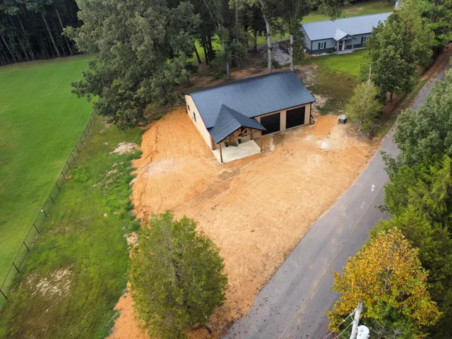 a view of house with yard