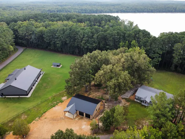 an aerial view of a house with garden space and street view