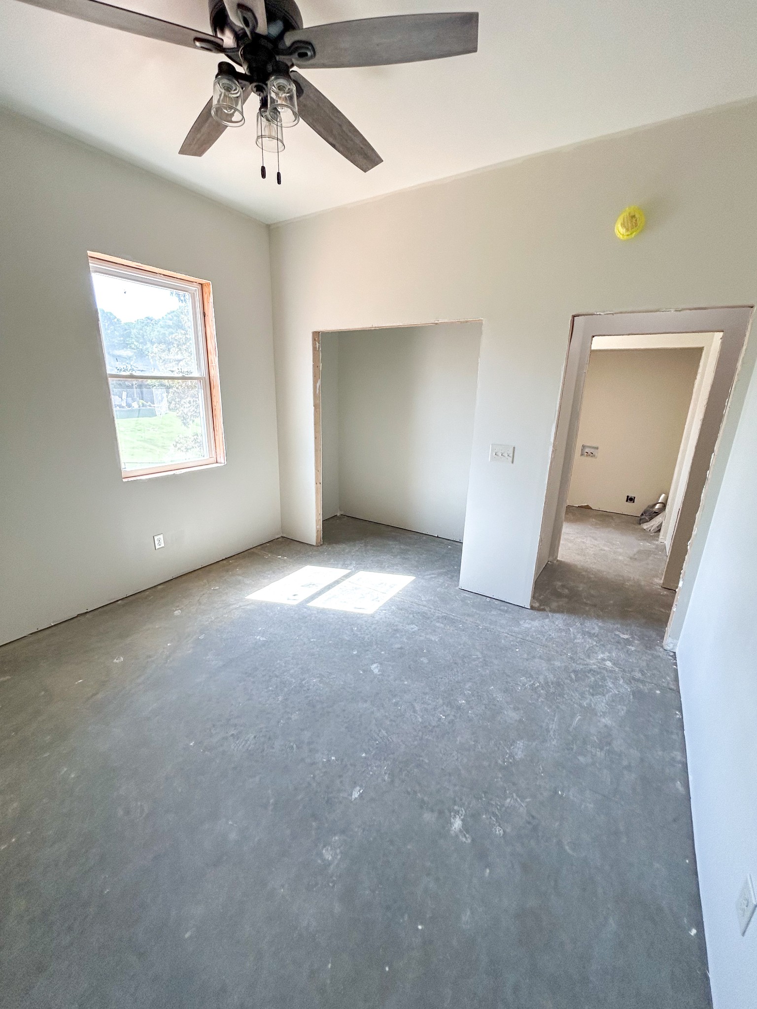 1539 Bull Durham Road Springville, TN 38256 - Photo 24 of 26 an empty room with a ceiling fan and a window