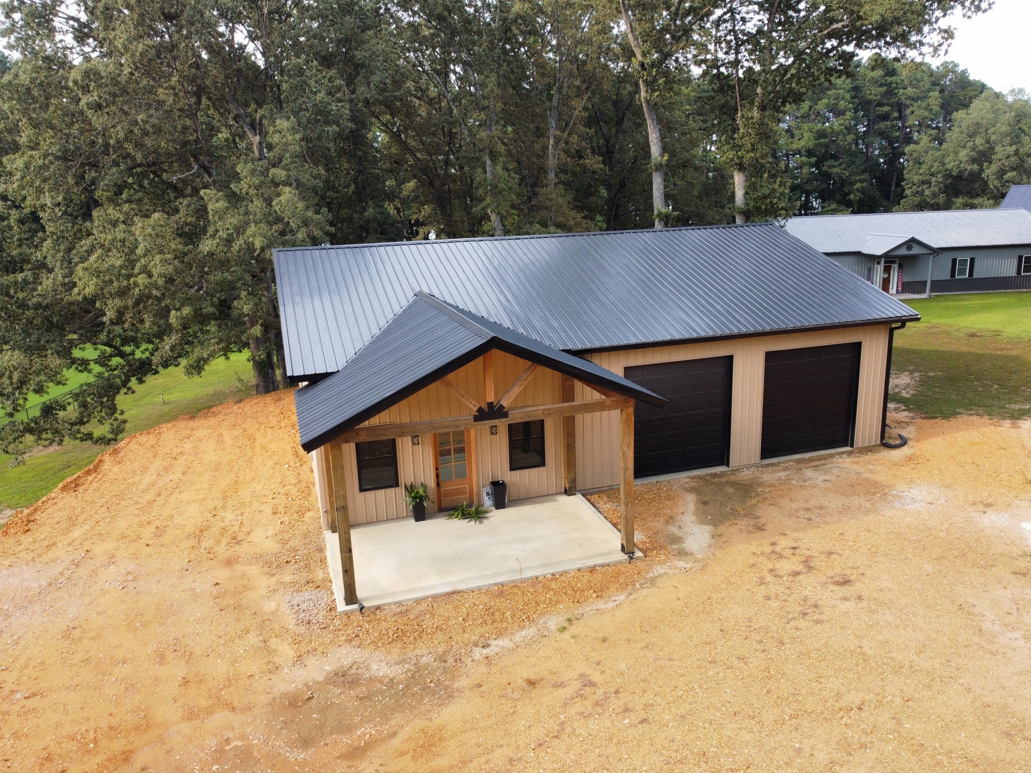 1539 Bull Durham Road Springville, TN 38256 - Photo 10 of 26 a view of a house with large trees and wooden fence