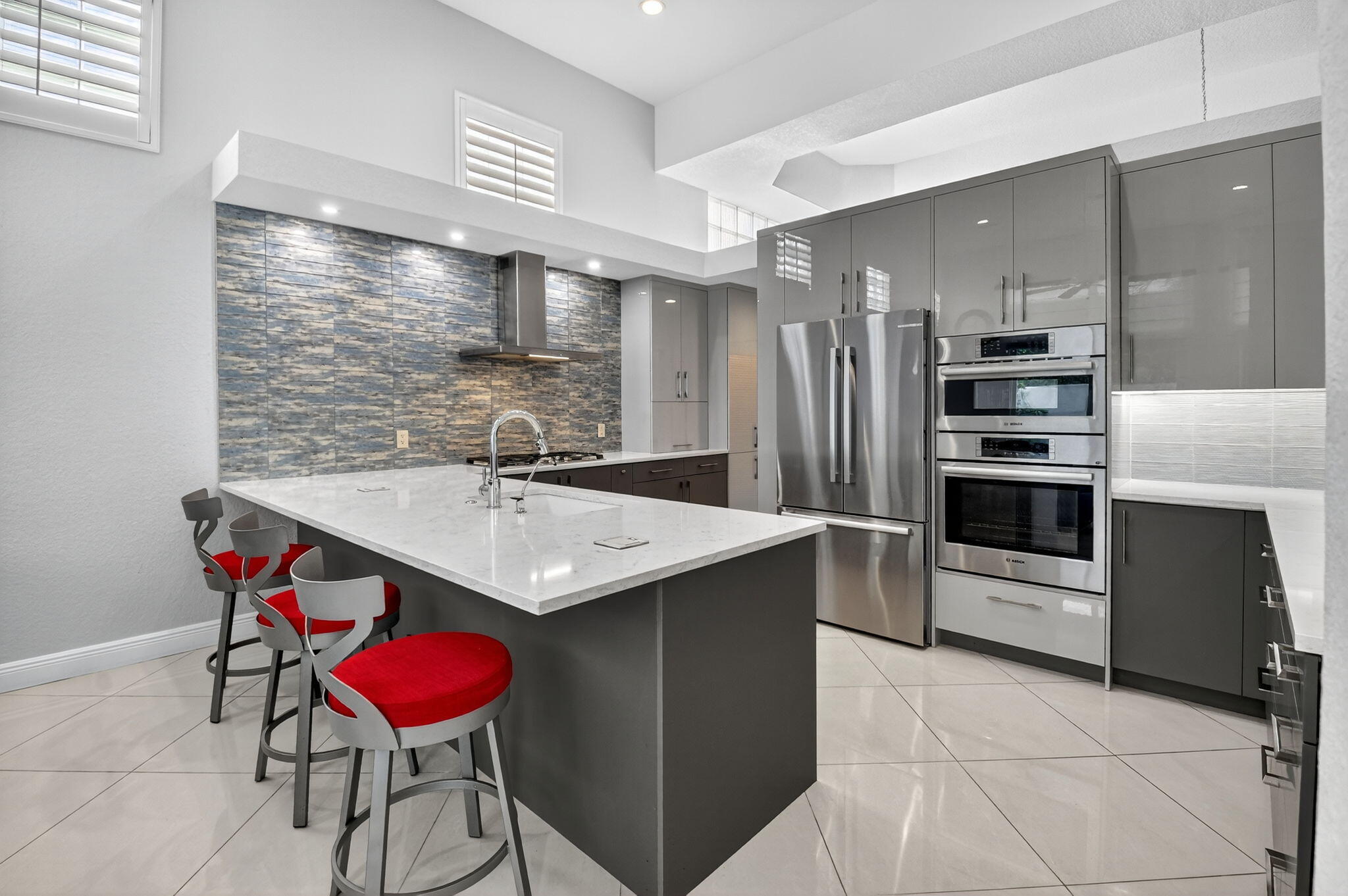 6535 Somerset Circle Boca Raton, FL 33496 - Photo 17 of 59 a kitchen with a sink stainless steel appliances and cabinets