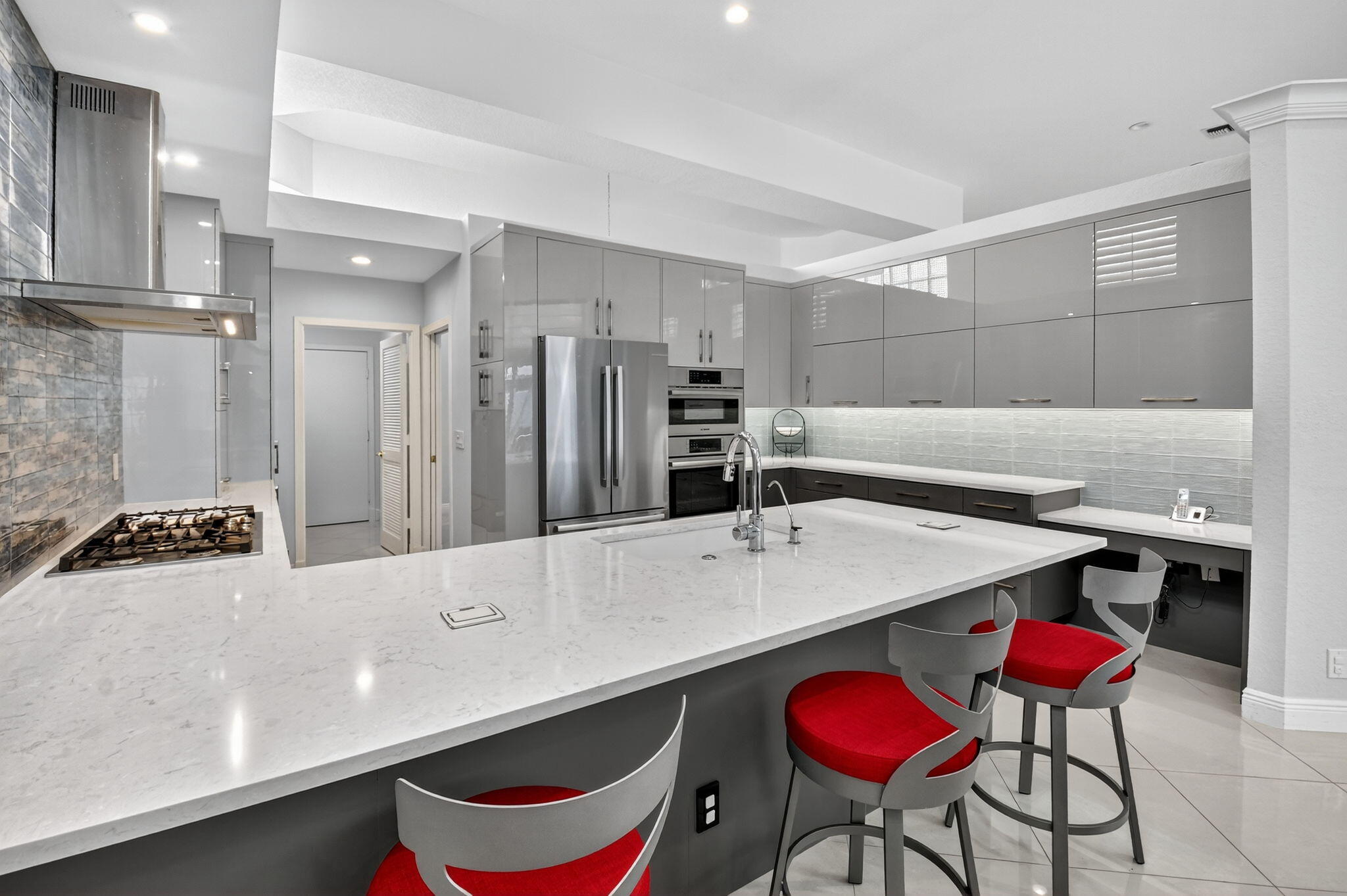 6535 Somerset Circle Boca Raton, FL 33496 - Photo 18 of 59 a kitchen with stainless steel appliances a sink and a refrigerator
