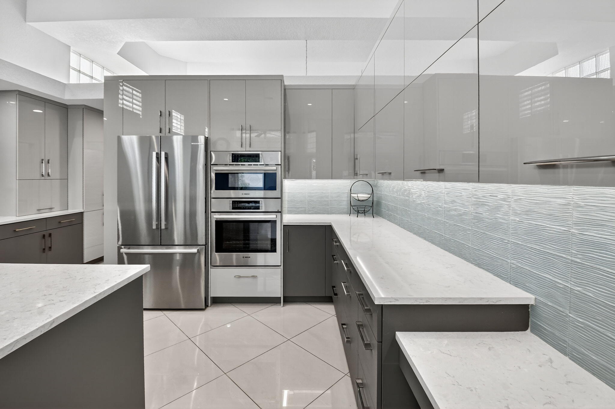 6535 Somerset Circle Boca Raton, FL 33496 - Photo 19 of 59 a kitchen with stainless steel appliances a refrigerator and a stove top oven