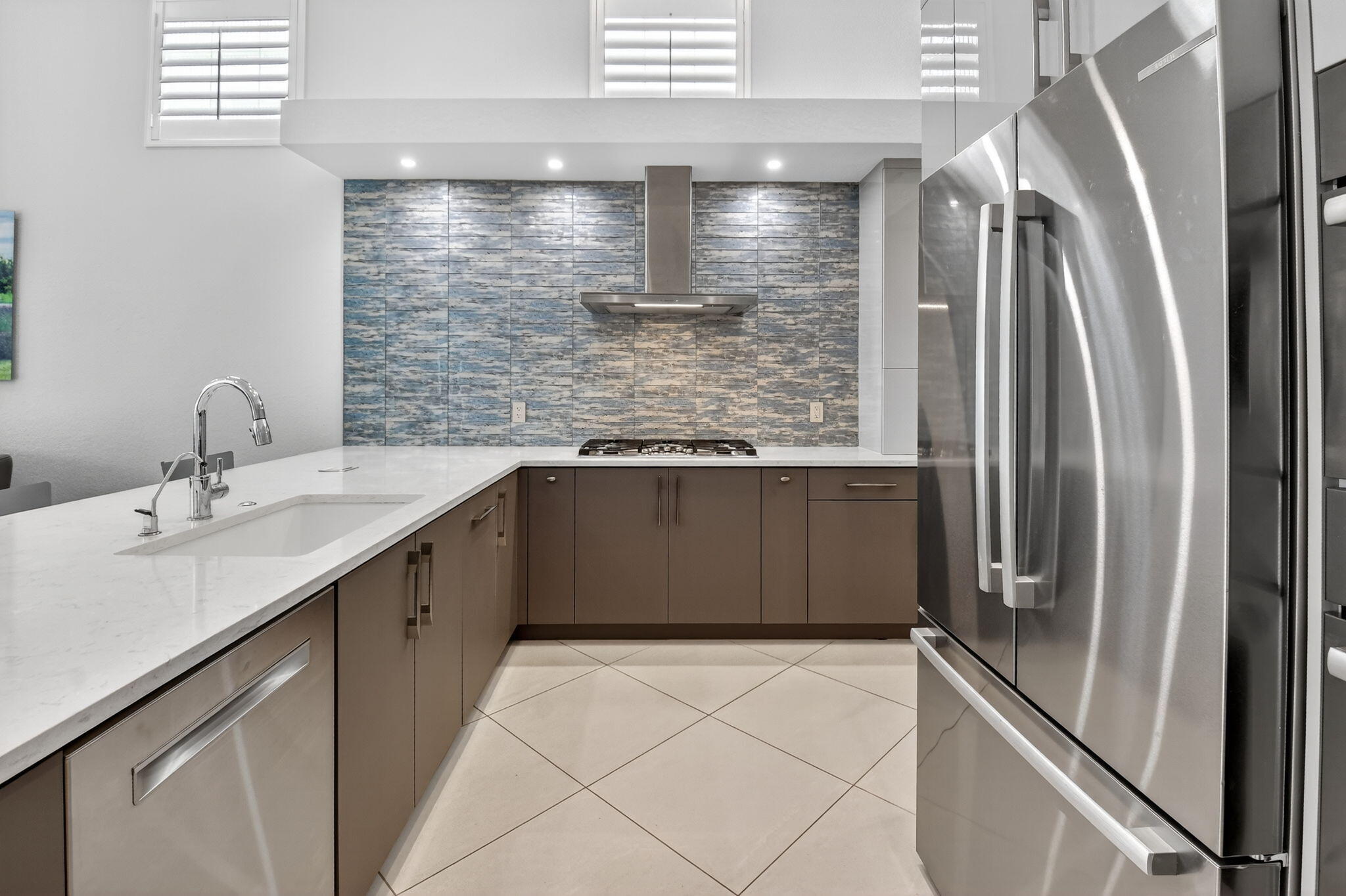 6535 Somerset Circle Boca Raton, FL 33496 - Photo 20 of 59 a kitchen with stainless steel appliances granite countertop a refrigerator and a sink