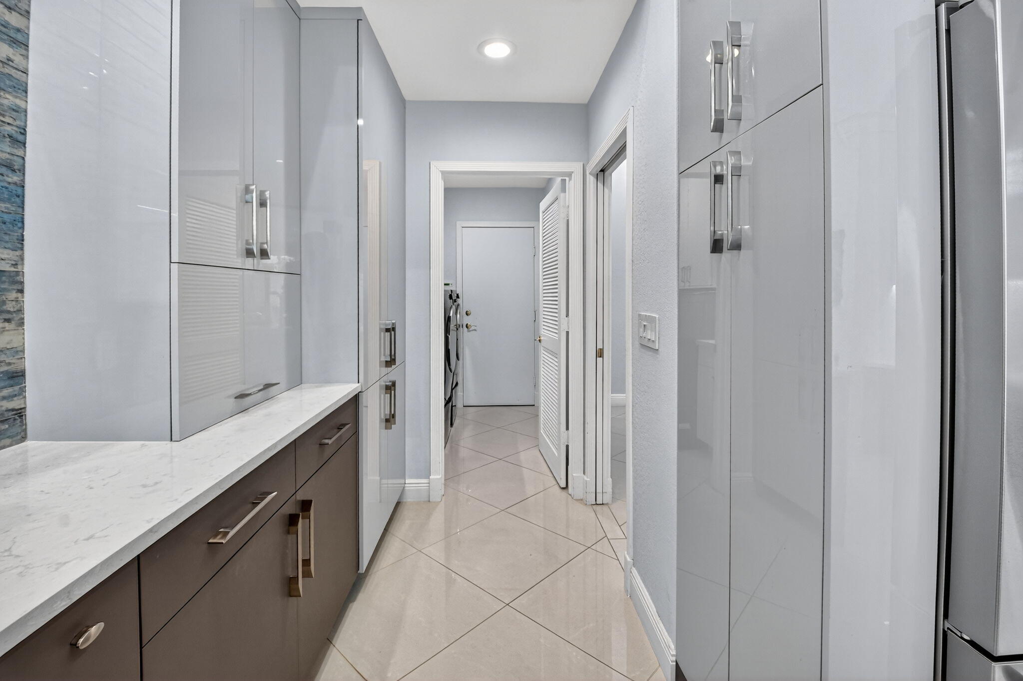 6535 Somerset Circle Boca Raton, FL 33496 - Photo 22 of 59 a bathroom with a double vanity sink and a mirror