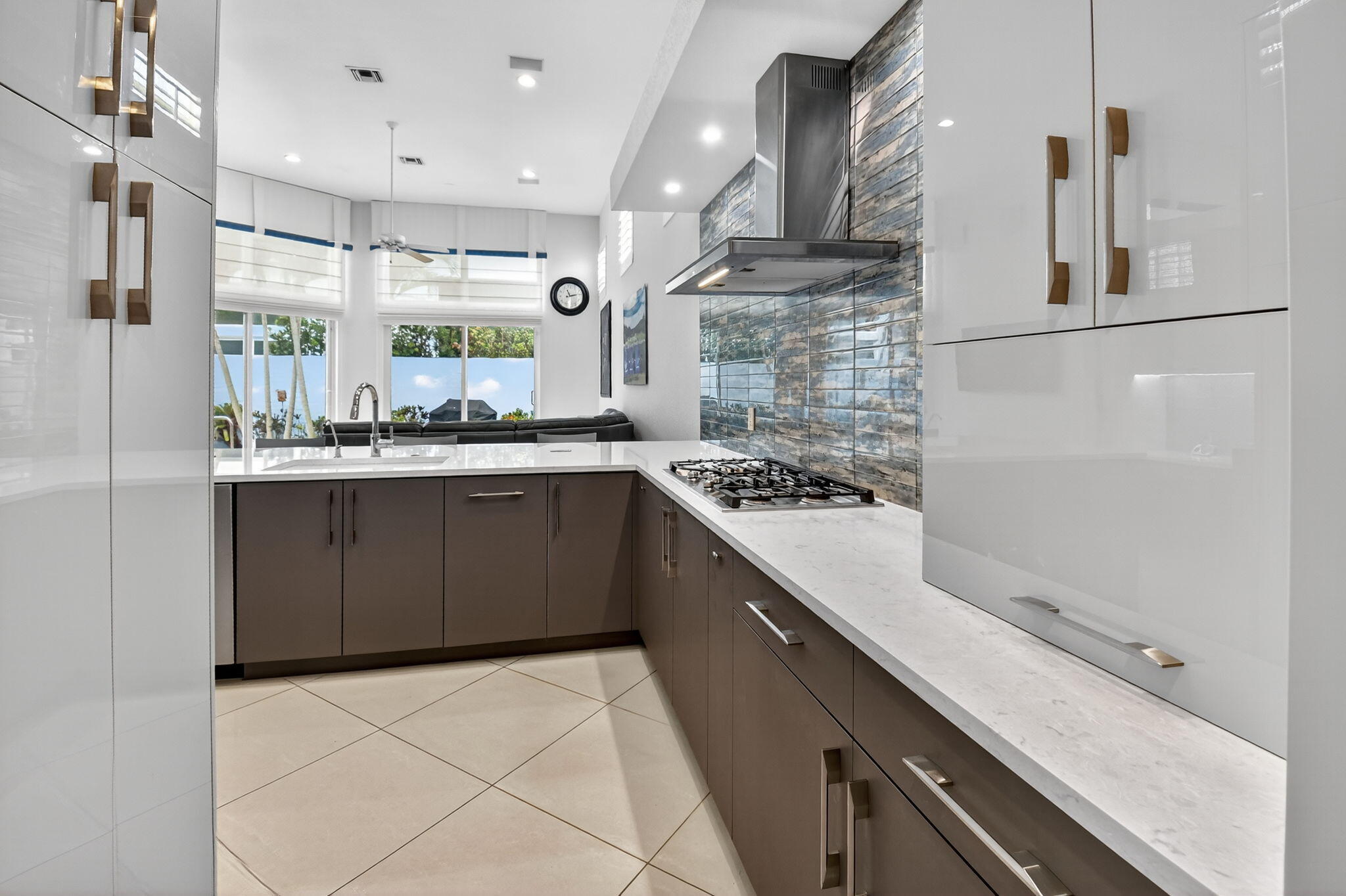 6535 Somerset Circle Boca Raton, FL 33496 - Photo 23 of 59 a kitchen with a sink and a stove top oven