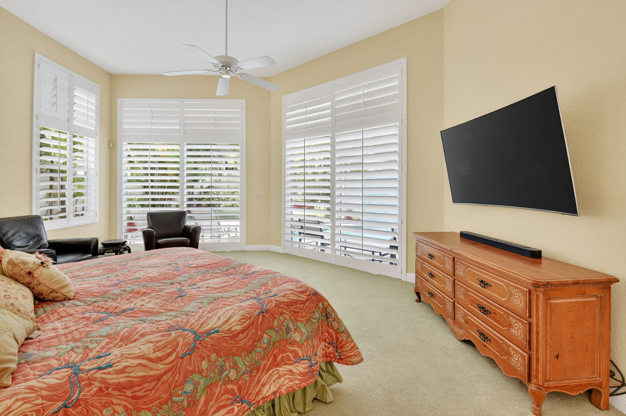 6535 Somerset Circle Boca Raton, FL 33496 - Photo 29 of 59 a bedroom with a bed and a flat screen tv on dresser
