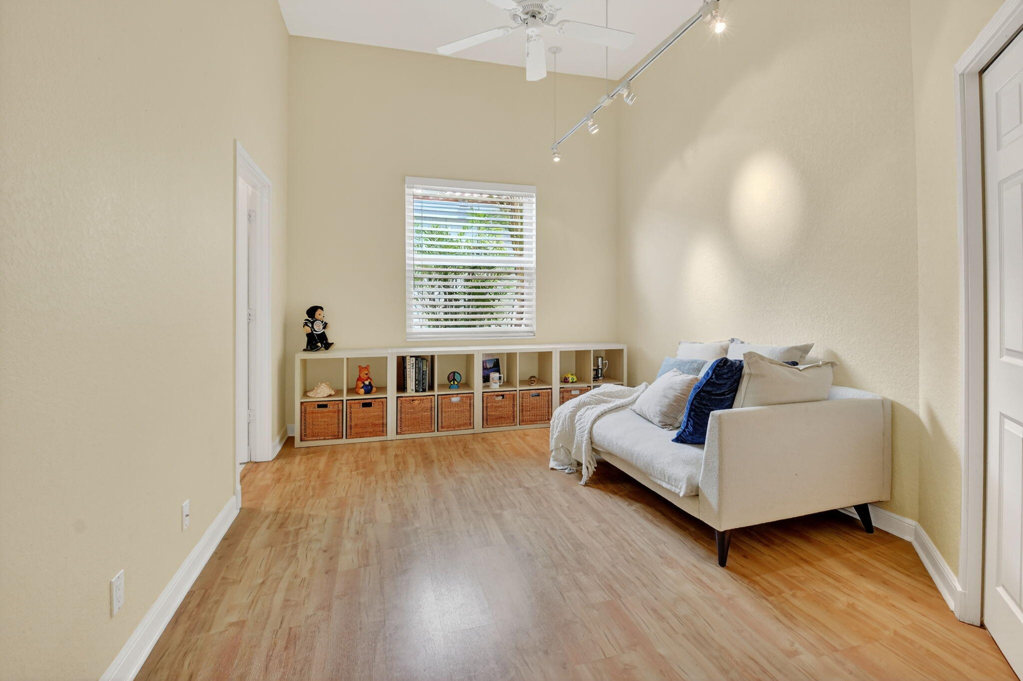 6535 Somerset Circle Boca Raton, FL 33496 - Photo 40 of 59 a spacious bedroom with a bed and a couch