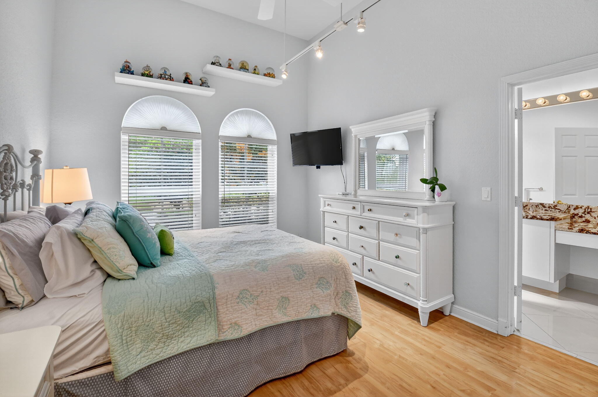 6535 Somerset Circle Boca Raton, FL 33496 - Photo 45 of 59 a bedroom with a large bed and a dresser