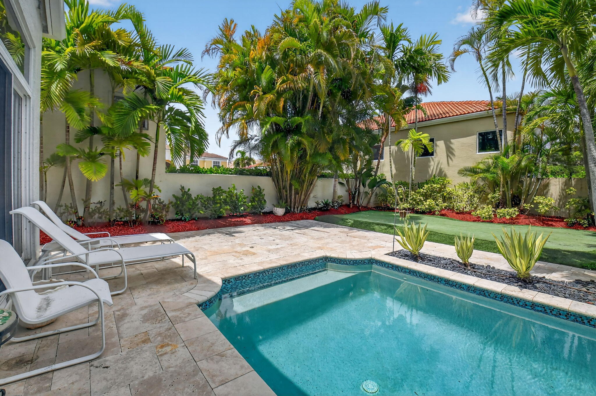 6535 Somerset Circle Boca Raton, FL 33496 - Photo 48 of 59 a view of swimming pool with lawn chairs and plants