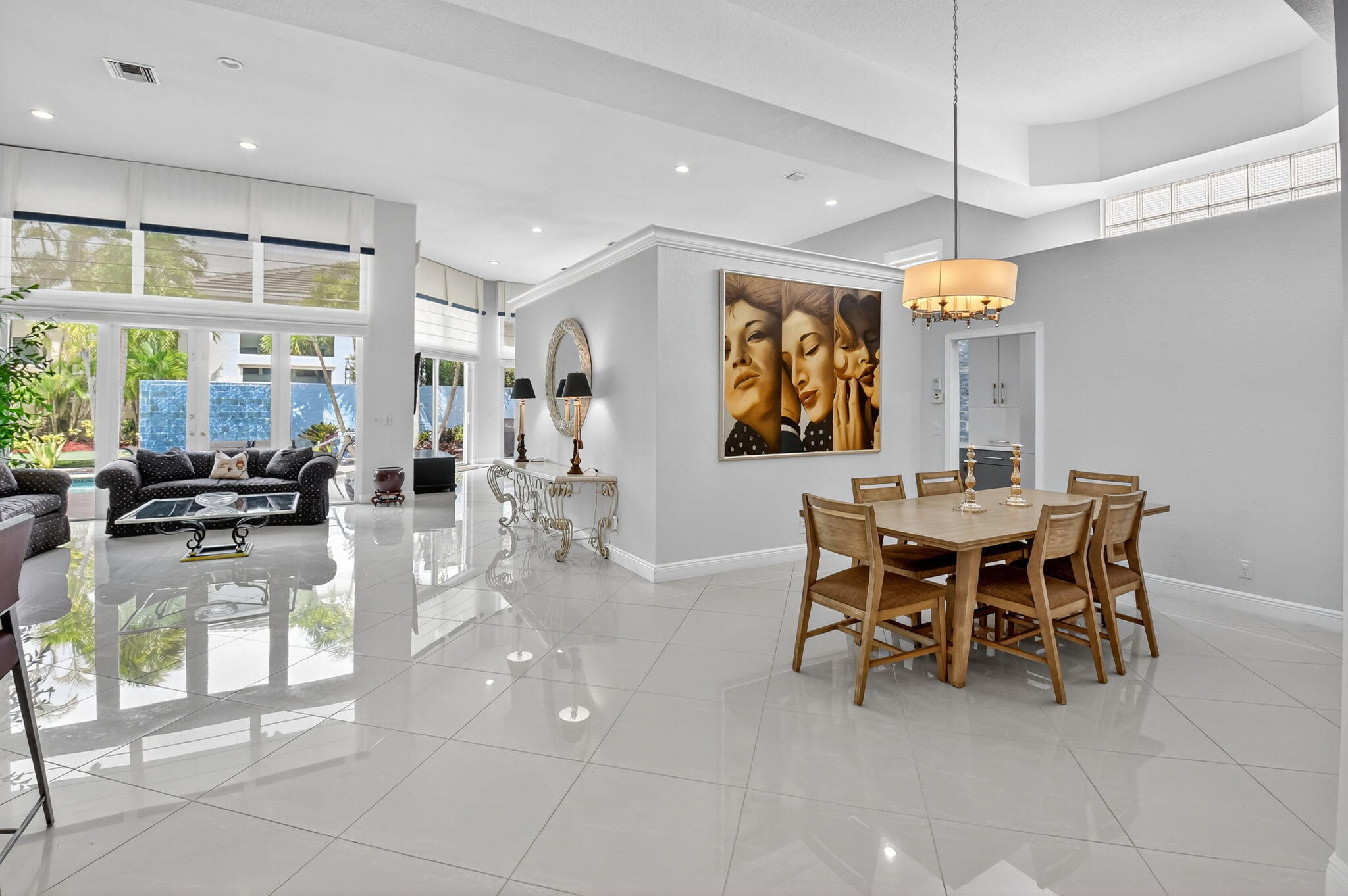 6535 Somerset Circle Boca Raton, FL 33496 - Photo 5 of 59 a dining area with glass top table and chairs