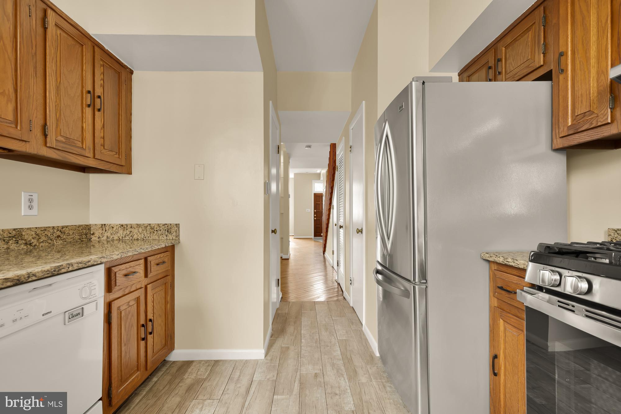 650 E Street Northeast, Unit A Washington, DC 20002 - Photo 12 of 31 a kitchen with stainless steel appliances granite countertop a refrigerator and a stove