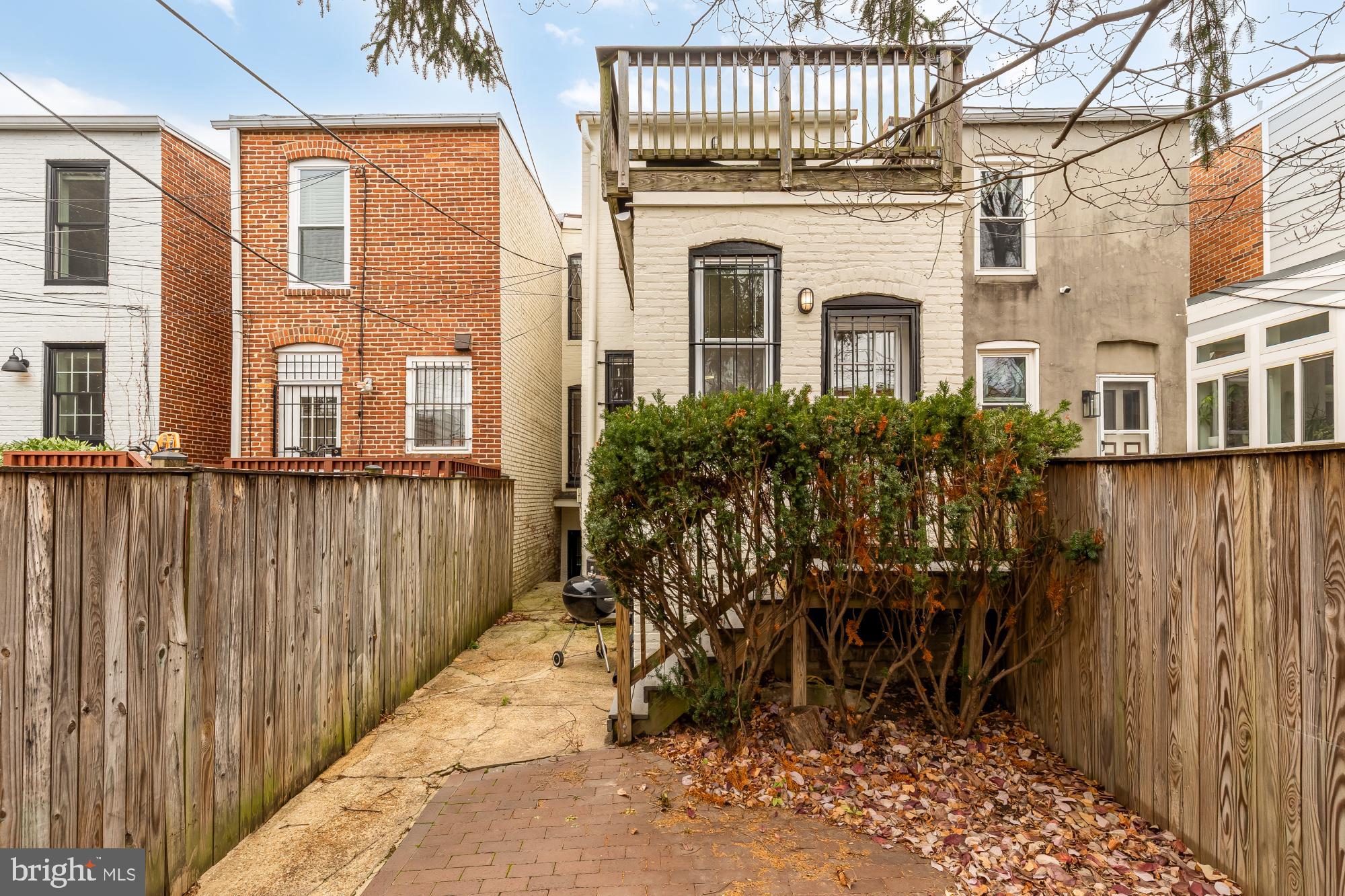 650 E Street Northeast, Unit A Washington, DC 20002 - Photo 17 of 31 a view of a white building among the palm tree