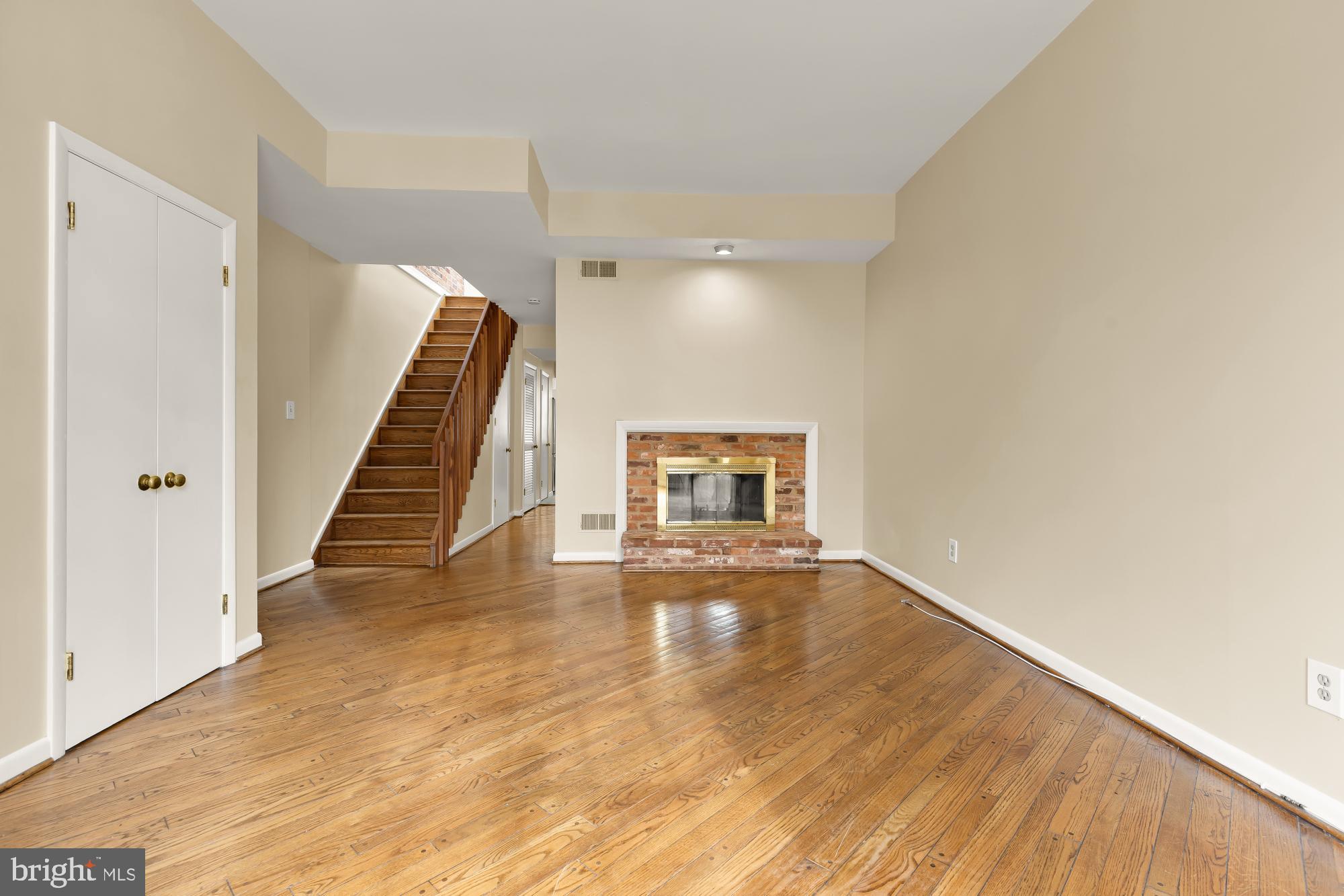650 E Street Northeast, Unit A Washington, DC 20002 - Photo 2 of 31 a view of a livingroom with wooden floor and stairs