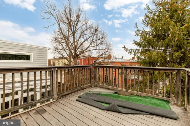 a view of wooden deck and a yard