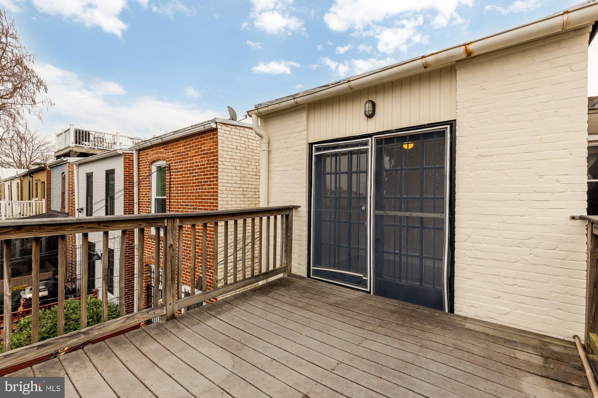 650 E Street Northeast, Unit A Washington, DC 20002 - Photo 22 of 31 a view of a house with wooden deck
