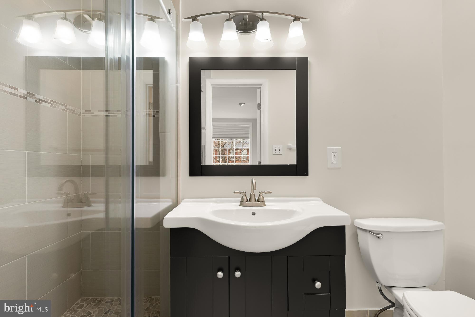 650 E Street Northeast, Unit A Washington, DC 20002 - Photo 30 of 31 a bathroom with a sink toilet and shower