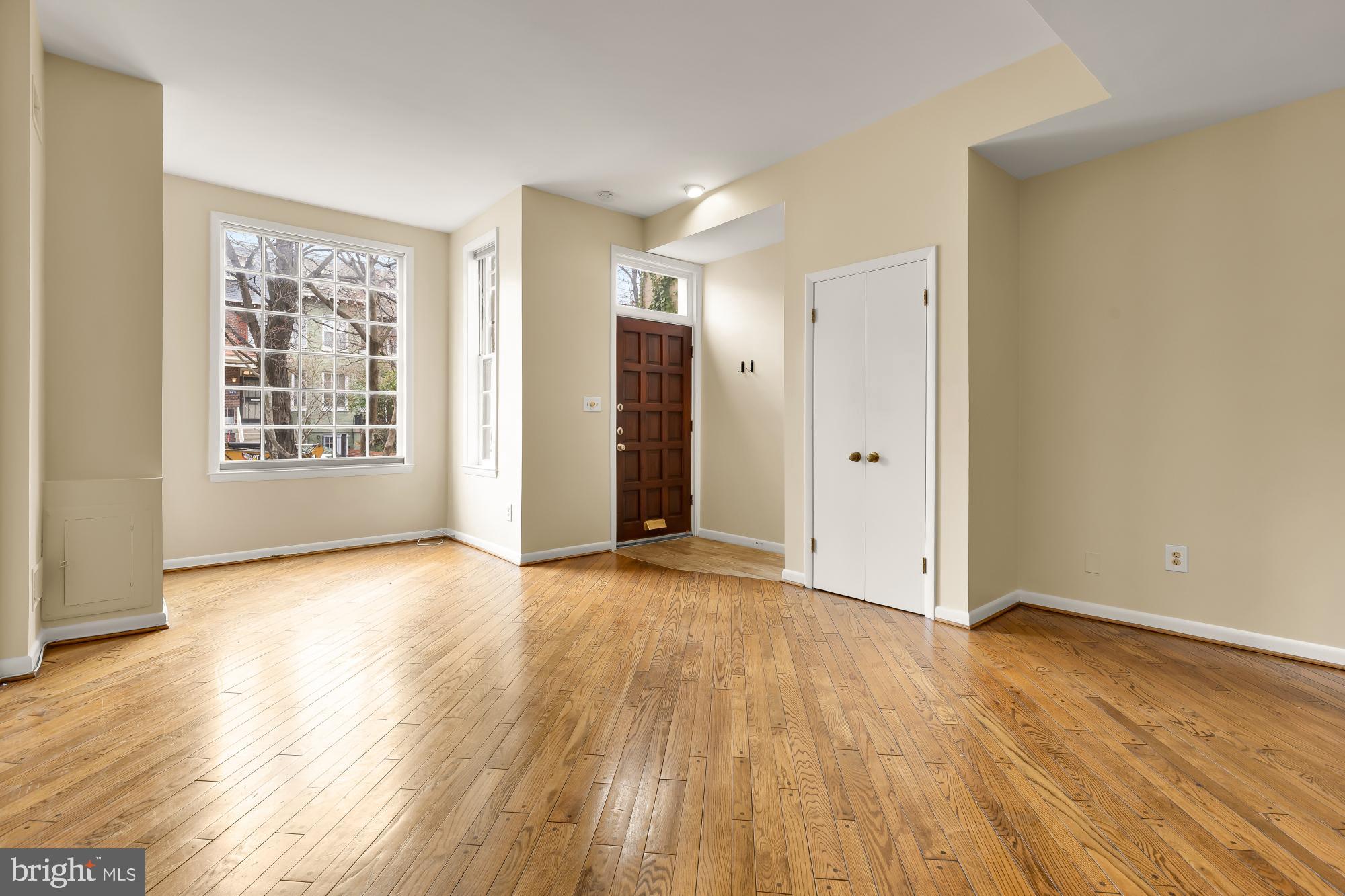 650 E Street Northeast, Unit A Washington, DC 20002 - Photo 3 of 31 a view of an empty room with wooden floor and windows