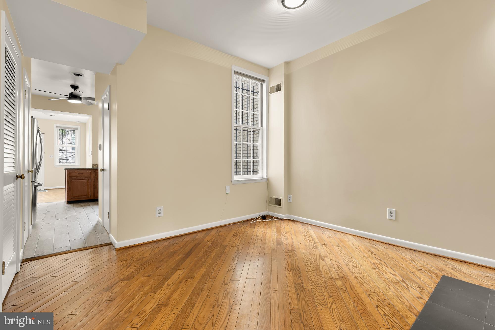 650 E Street Northeast, Unit A Washington, DC 20002 - Photo 4 of 31 an empty room with wooden floor and windows