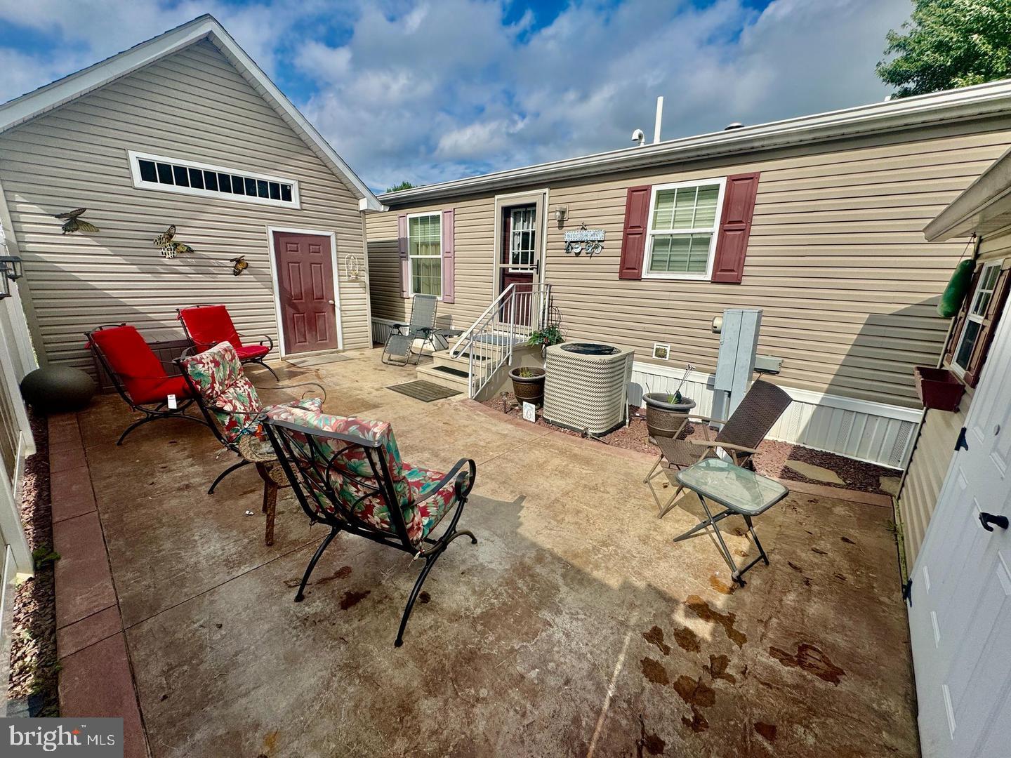 133 Ridgewood Manor Manheim, PA 17545 - Photo 12 of 38 a view of a patio with table and chairs and potted plants