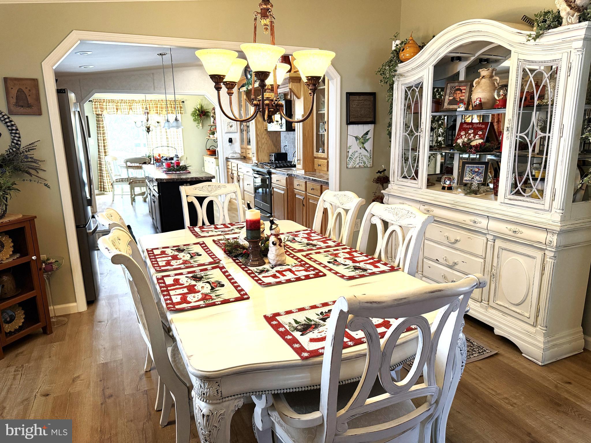 133 Ridgewood Manor Manheim, PA 17545 - Photo 16 of 38 a view of a dining room with furniture and chandelier