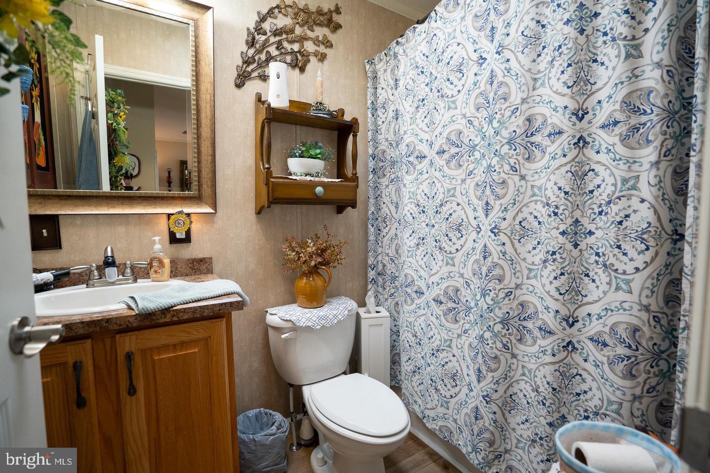 133 Ridgewood Manor Manheim, PA 17545 - Photo 31 of 38 a bathroom with a granite countertop toilet sink and mirror