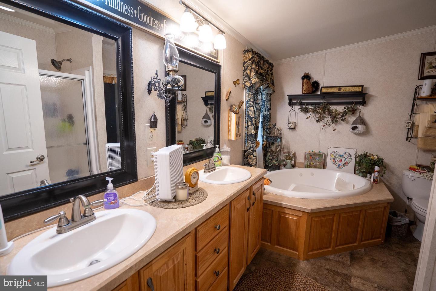 133 Ridgewood Manor Manheim, PA 17545 - Photo 36 of 38 a bathroom with a double vanity sink and a mirror