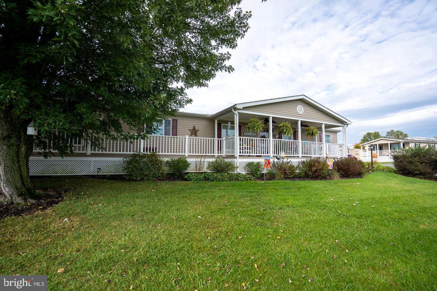 133 Ridgewood Manor Manheim, PA 17545 - Photo 4 of 38 a view of a house with a yard and sitting area