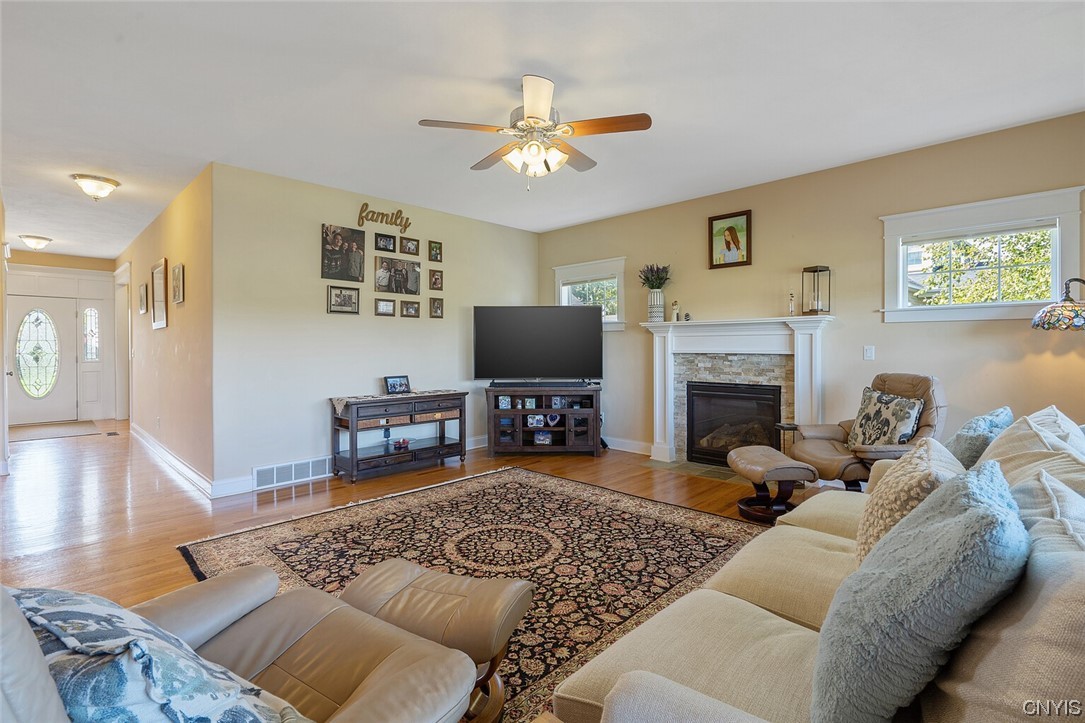 3443 Long Shadow Drive Lysander, NY 13027 - Photo 12 of 49 Great room has a beautiful understated fireplace w