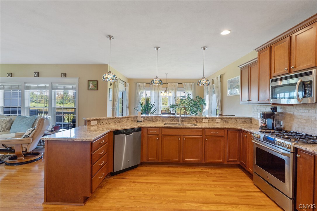 3443 Long Shadow Drive Lysander, NY 13027 - Photo 21 of 49 Those hardwoods add more warmth to this lovely ran