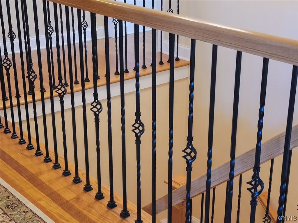 3443 Long Shadow Drive Lysander, NY 13027 - Photo 41 of 49 Stunning woodwork and railing to the basement leve