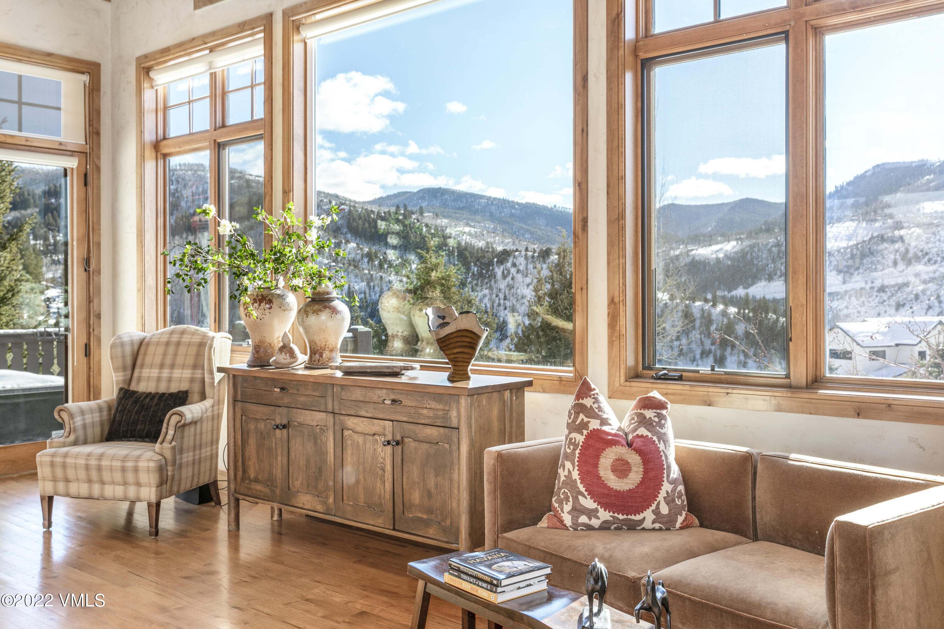 875 Cordillera Way Edwards, CO 81632 - Photo 14 of 57 a dining room with furniture large windows and wooden floor