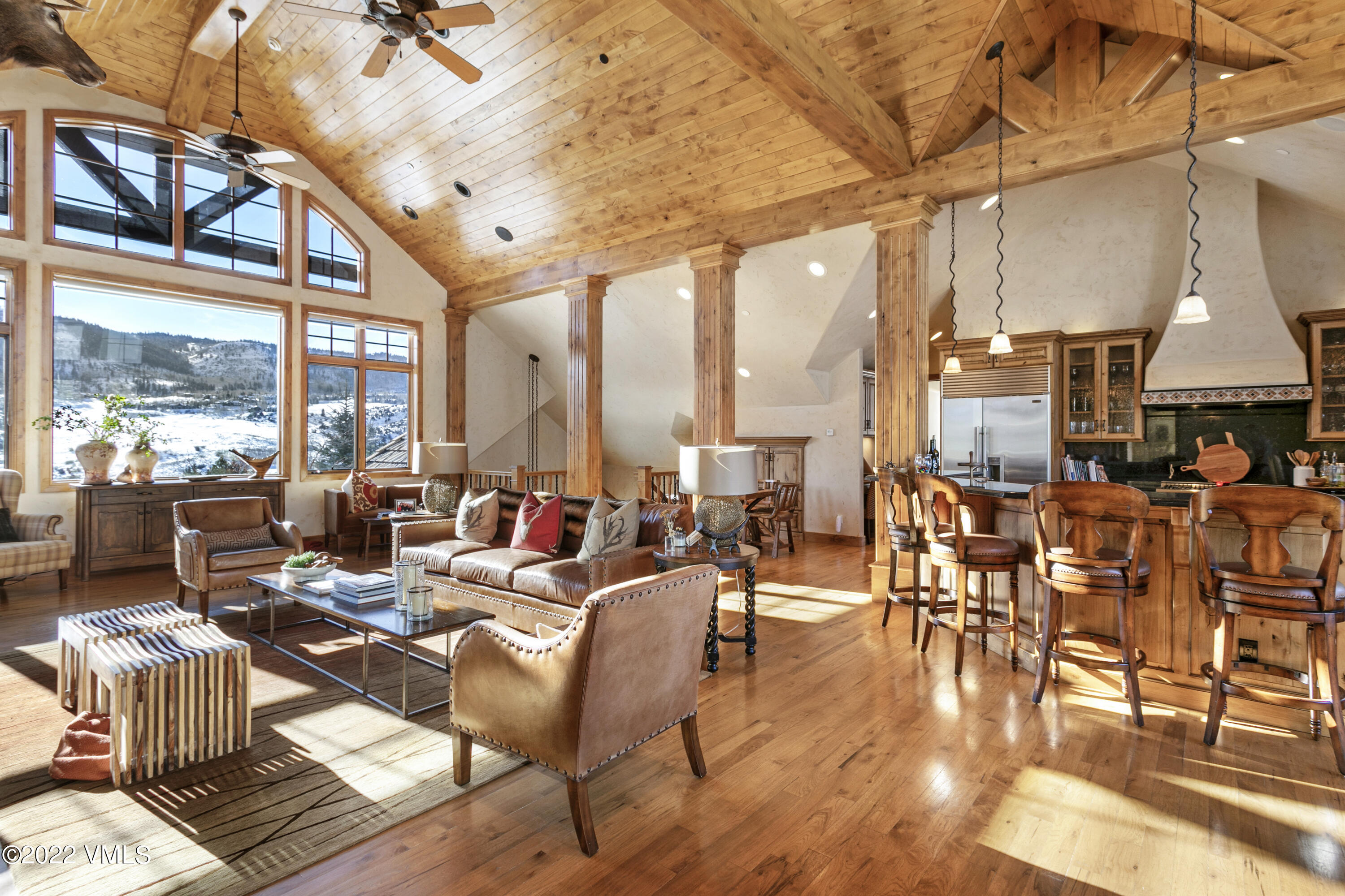 875 Cordillera Way Edwards, CO 81632 - Photo 15 of 57 a living room with lots of furniture and a large window