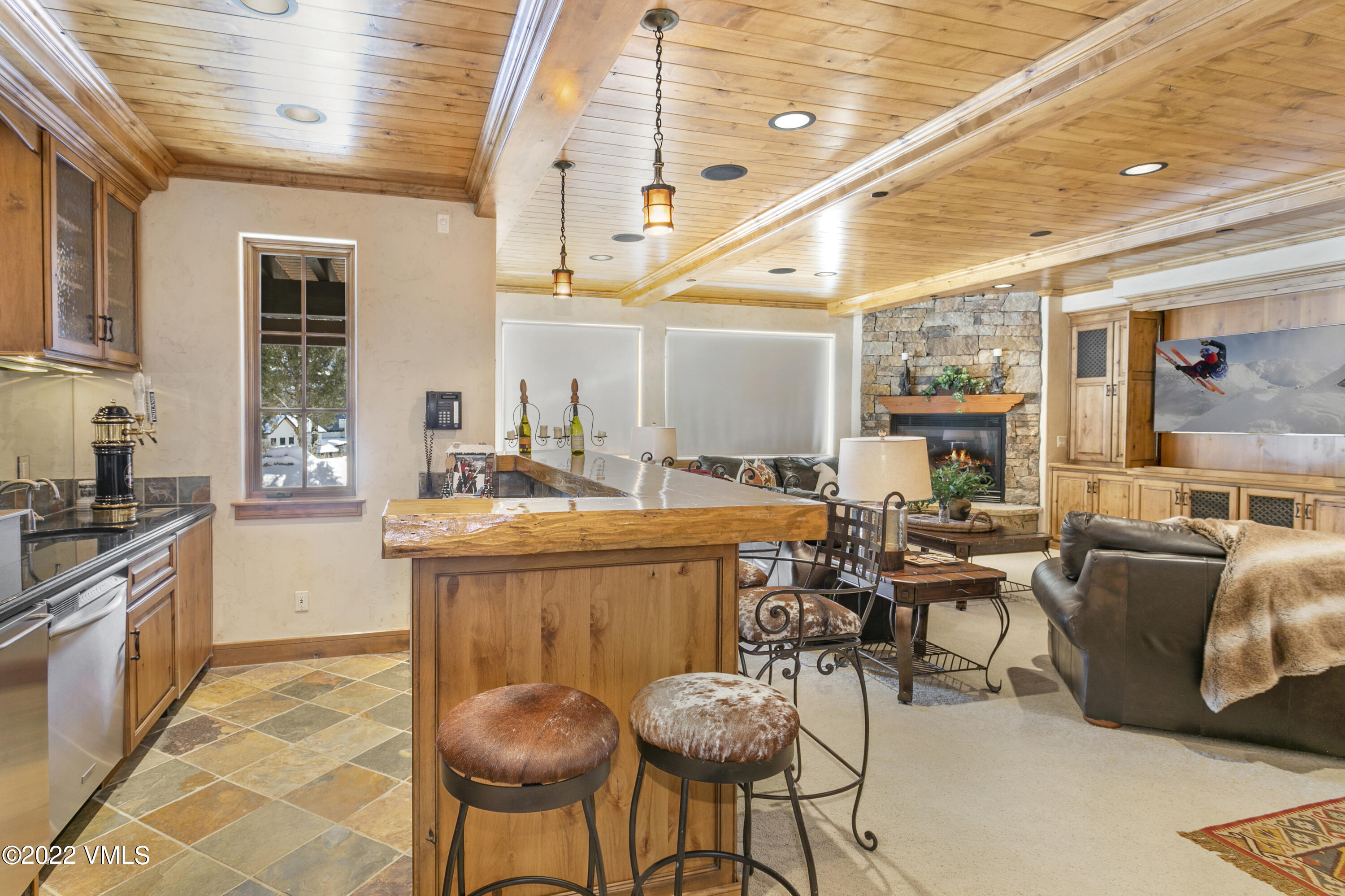 875 Cordillera Way Edwards, CO 81632 - Photo 27 of 57 a large kitchen with a table and chairs