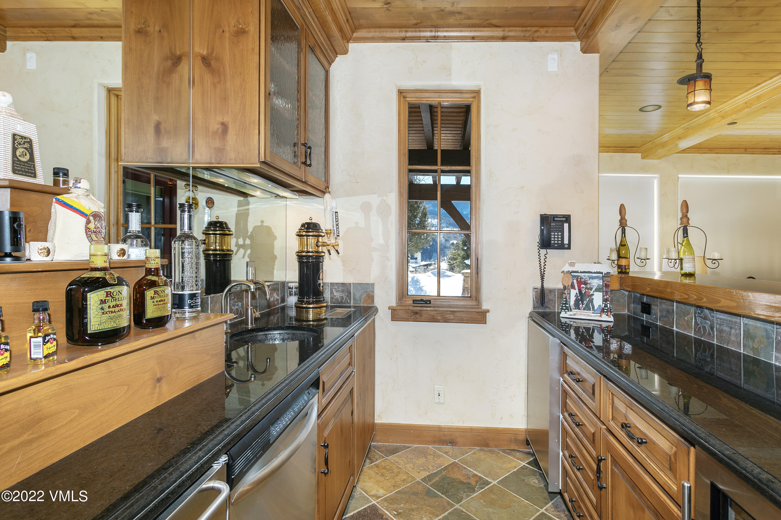 875 Cordillera Way Edwards, CO 81632 - Photo 29 of 57 a kitchen with granite countertop a sink and a stove